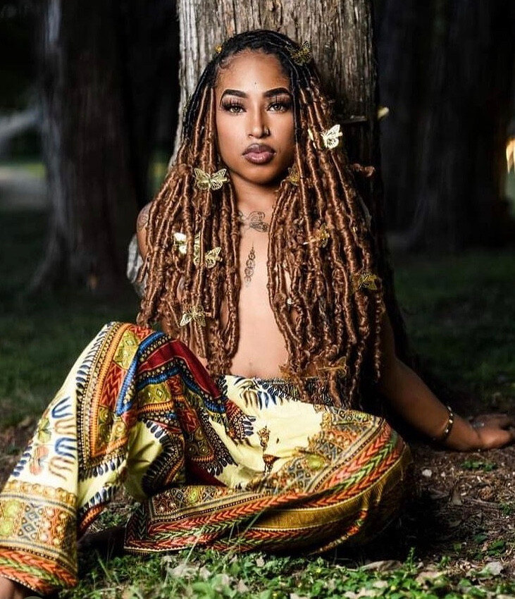 Portrait of DaToneyia, braid stylist and owner of Crowned by DayDay
